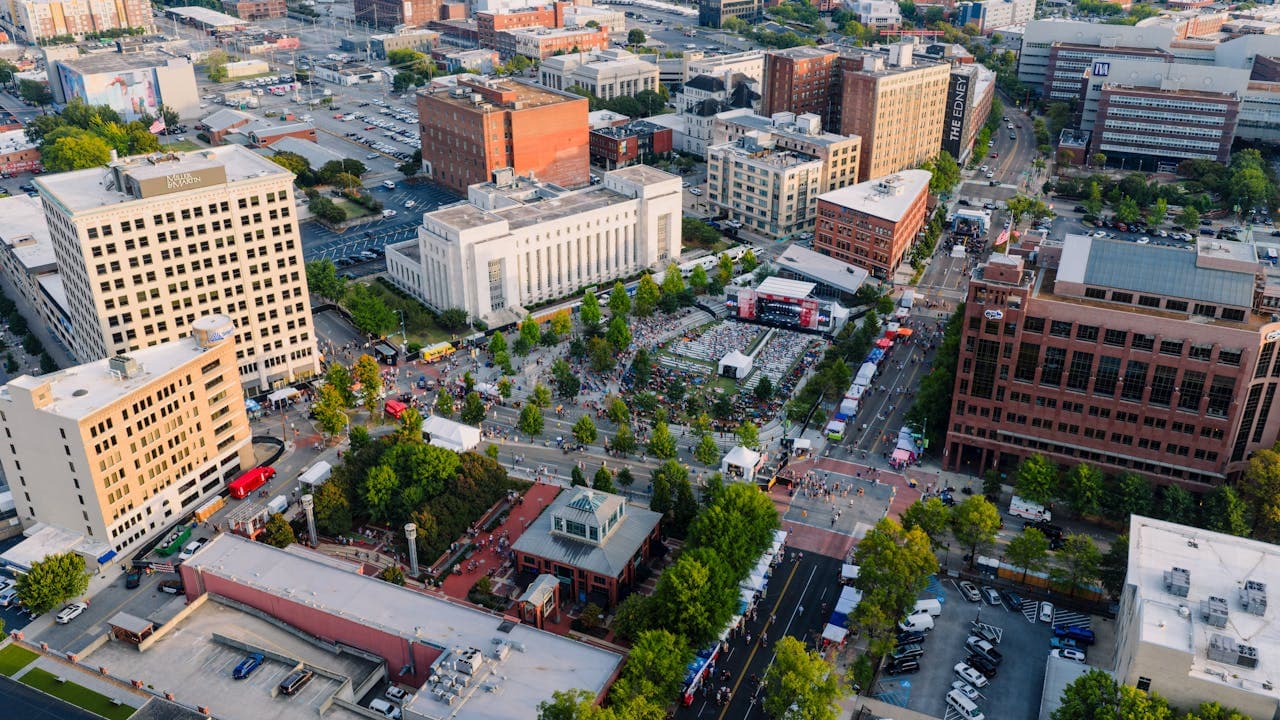 Community members engaged in conversation at a downtown event